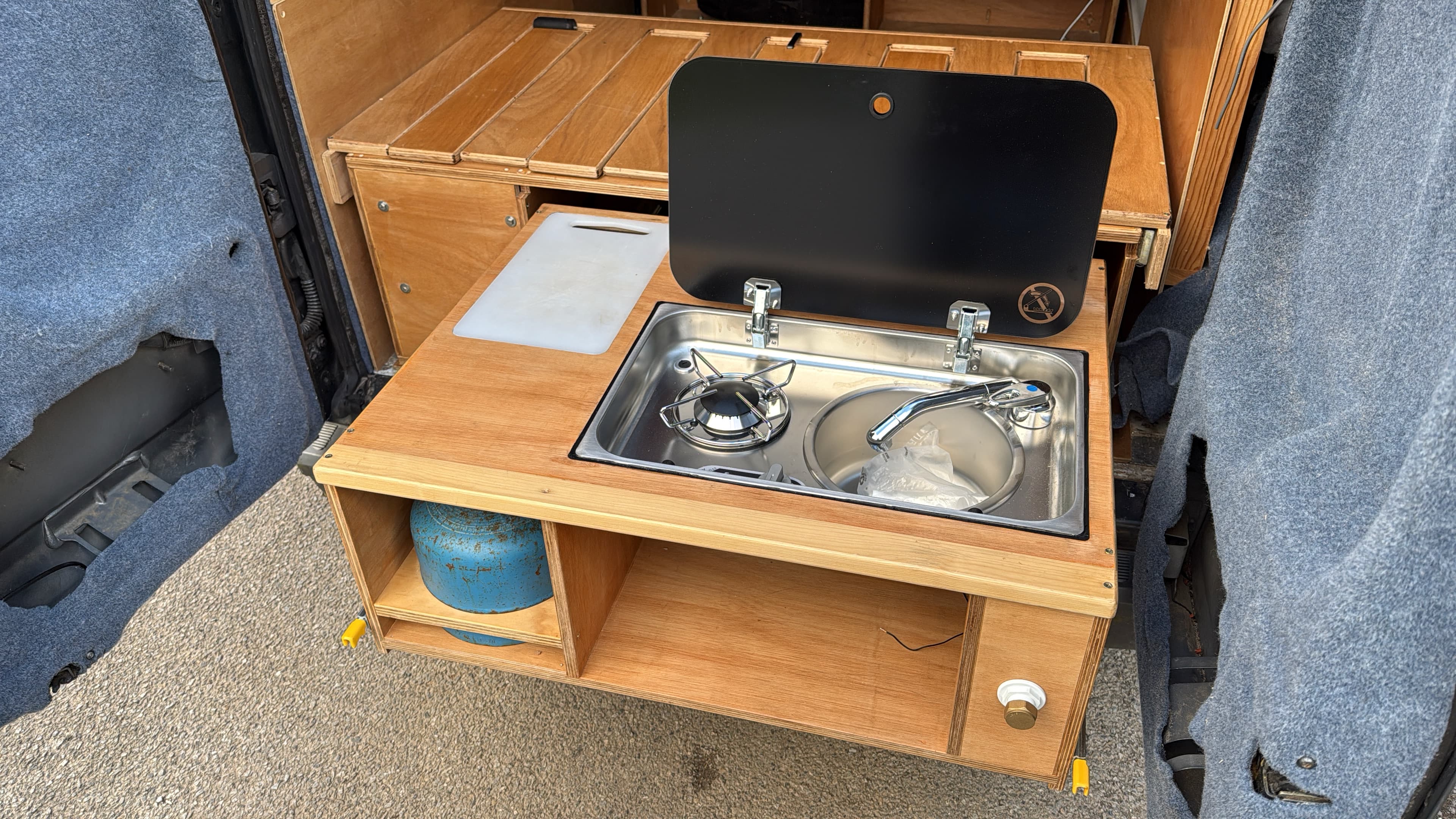 Van pull-out kitchen in use at sunset